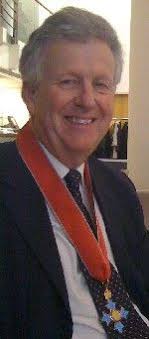 Dr Michael Schluter is presented with CBE