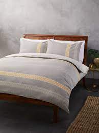 Yellow and gray bedding is a modern color combination that can freshen up any bedroom in the house. John Lewis Partners Ahlam Duvet Cover Set