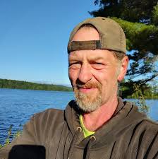 What is the composition of the rock found in the gravel pit?