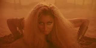 Directed by mert alas and marcus piggott, the visual begins with a few paragraphs telling a fictional tale about an ancient queen who was betrayed by her kingdom. Watch Nicki Minaj S New Ganja Burn Video Pitchfork