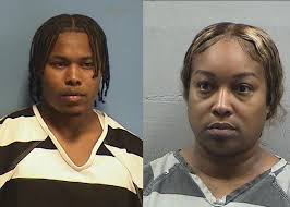 Sign: 28 Dogs Found Starving and Injured in Dogfighting Ring Run by Mother  and Son