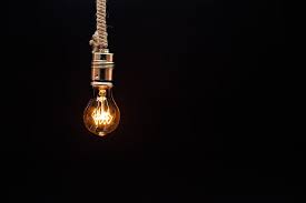 Clear Glass Light Bulb Turned On In Dim Light Pikrepo