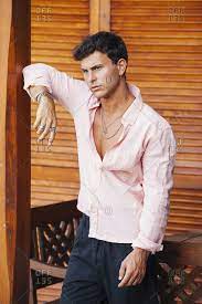 While many dress shirts can be worn tucked or untucked, note that shirts with curved, uneven seams with obvious shirt tails are designed to be tucked into your pants. Unbuttoned Stock Photos Offset