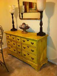 Distressing furniture really isn't very difficult, but it does require a bit of an eye for design. Annie Sloan Chalk Paint Old English Yellow Distressed With Dark Wax Yellow Painted Furniture Annie Sloan Painted Furniture Painted Furniture