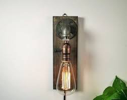 A strategically placed wall sconce can brighten an area the primary light doesn't quite reach. Sconce Lights Etsy
