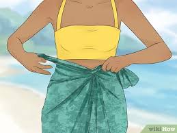 Tie the top 2 corners around the back of your neck. 4 Ways To Tie A Pareo Wikihow