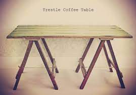 collapsible trestle coffee table made from reclaimed rimu native to nz tabletop is tongue and groove distressed pale green with bright blue undertones and