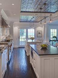 Alternatively, reclaimed wood can also be used as exposed ceiling beams to create a more natural feel for a farmhouse style kitchen. Pin 1 This Award Winning Nantucket Style Kitchen Features A Hand Stamped Tin Ceiling Over Th Kitchen Ceiling Design Rustic Farmhouse Kitchen Spacious Kitchens