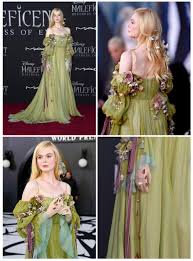 Elle Fanning wore a custom Gucci pale green and blue gown embroidered with  crystal straps, floral embellishments and cascading crystal blood drops to  the Hollywood premiere of Disneys Maleficent: Mistress Of Evil. [