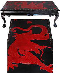 The bodies extending into three scrolled legs. Flying Dragon Coffee Table Is Urbane And Classy Luxurylaunches
