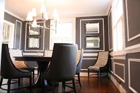 A Barrage Of Picture Moldings Against Dramatic Charcoal Walls Gives A Hollywood Regency Panache To Thi Grey Dining Room Paint Chic Dining Room Grey Dining Room