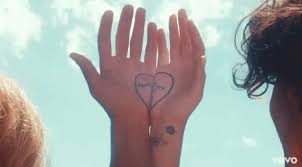 A lotus flower on her wrist; Katy Perry S Never Really Over Video Director Philippa Price On Turning Heartbreak Into Therapy Mtv