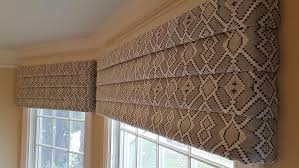 Box curtain next to dining room curtains alongside valance pattern and cove ceiling. Custom Window Valances Rosen Interiors