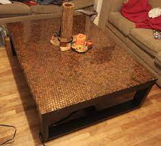 Metal coffee tables offer a sophisticated look, while wooden ones have a more vintage vibe. I Covered My Coffee Table With 4500 Pennies It Took About 25 Hours 75 Worth Of Super Glue And Two Coats Of Epoxy But I Think It Turned Out Alright Coffee