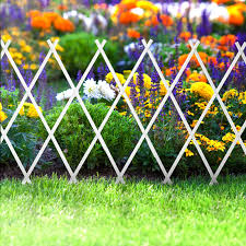 Not only do these wooden fences provide an attractive highlight, they also help keep unwanted critters out of your flowers. Flowerbed Border Fence Extendable Cridem