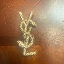 ysl lapel pin
