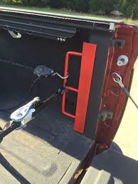 Truck Tie Down Made From 2 X 2 Angle Iron And Some 1 2 Rod Bent So There Is A 2 5 Space Over 12 Wit Truck Accessories Truck Bed Accessories Chevy Trucks