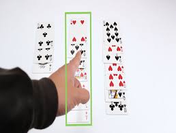 Cut the cards at the split so there are 25 cards in each pile. Learncards