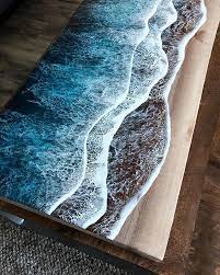 Live Edge Ocean Surface Tables By Rivka Wilkins And Jared Davis 5 These Live Edge Ocean Shore Coffee Tables Are Cool Coffee Tables Resin Furniture Ocean Shores