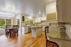 white kitchen room with dining table