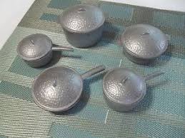 Antique toys vintage toys little nemo in slumberland pull toy tin toys antiques awesome books antiquities. Vintage Child S Toy Play Set Of Hammered Aluminum Cookware Pots And Pans Aluminum Cookware Pots And Pans Pot And Pan Set