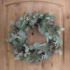 Different flowers form a cluster around a twig like base for an interesting mix of design that brings visual interest to spaces. Sparkling Berry And Eucalyptus Leaf Wreath Kirklands
