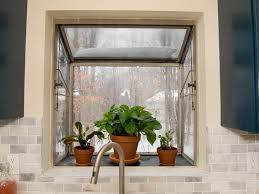 An angled bay is the most common type of bay window that works well in any style or shape of kitchen. Potted Plants In Kitchen Bay Window Hgtv