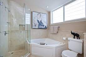 The modern tiling goes seamlessly from tub to shower, too. Separate Corner Tub And Combo Shower Design For Small Bathroom Remodel Design And Dec Bathrooms Remodel Budget Bathroom Remodel Bathroom Remodel Small Budget