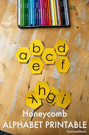 Each page of this resource features a different letter of the alphabet with a bumblebee illustrations framing each one. Printable Bee Alphabet Honeycomb Letters Nurturestore