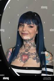 Milan, Italy Milan TATTOO CONVENTION 2020 Exhibition of international  tattoo artists with moments of the creation of the single tattoo. Pictured:  Riae and her portrait tattoos Stock Photo - Alamy