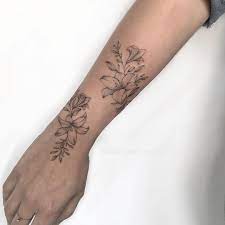 Check spelling or type a new query. Pin By Stefanie Mcentyre On Tattoo Vine Tattoos Wrap Around Wrist Tattoos Wrist Tattoos For Women