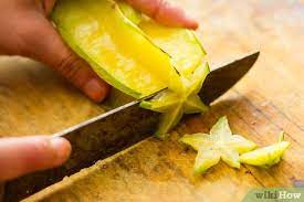 On a cutting board, lay down the star fruit vertically. How To Eat A Star Fruit 14 Steps With Pictures Wikihow
