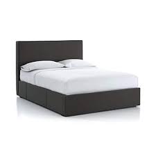 Storage headboards are usually free standing and include drawers, shelving, and hidden compartments to conceal clothing or other items. Flange King Upholstered Headboard With Storage Base Carbon Crate And Barrel
