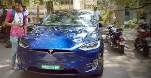 The model x claims a driving range of 474 km on a single charge. Watch The Tesla Model X Show Off Its Falcon Doors On Indian Streets Video