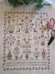 Qu Est Ce Qu Il Est Beau Christmas Garden Cross Stitch Samplers Cross Stitch Designs Cross Stitching