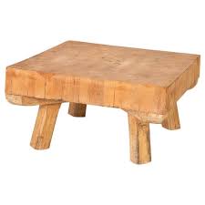 Sporting mango wood construction, this square shaped coffee table features a glass tabletop with beveled edges and a stunning sunburst pattern, showing a variation of color tones. Vintage Square Coffee Table Made From Heavy Butcher Block Table At 1stdibs