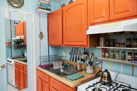 bright orange kitchen cabinets sit
