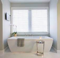 The spruce / theresa chiechi. Bathroom Tv Design Ideas