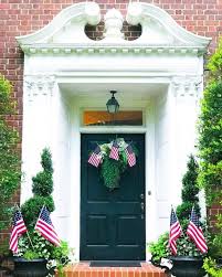 Brick colonial home updated with shutters & new entry. Colonial Style House Front Door Red Brick Decorate With Flags Planters Wreath Fourth Of July The Glam Pad