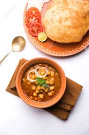 Firstly, adding soda will gives nice texture to the puri. Chole Bhature Or Chick Pea Curry And Fried Puri Served In Terracotta Stock Photo Picture And Royalty Free Image Image 102977736