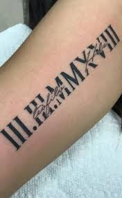 Bird in flight plus roman numerals shoulder tattoo. 50 Sensational Roman Numeral Tattoos Tattoo Me Now