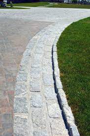 Hammer the edging into the ground so that it extends to approximately 1 inch below the top of the pavers. Top 40 Best Driveway Edging Ideas Inviting Border Designs Driveway Edging Stone Driveway Driveway Design