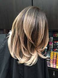 This takes curly medium length layered cuts to the highest levels by going all out with highlights and lowlights! Pin On Medium Hair