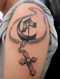 A rosary tattoo, which is usually paired with a cross can be a perfect mark to represent your spiritual inclination. Rosary Bead Tattoo Ideas Designs And Meanings Tatring