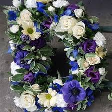 Let our trusted sympathy specialists help you pick the right arrangement & flowers. Dad Tribute Blue White Rays Florist Funeral Flowers 01252311966