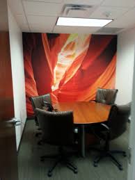 What are the current trends in conference room design? Small Conference Room With Video Call Backdrop Decorating With Wallpaper Wall Murals