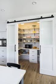 Sliding Barn Doors Aren T Just For Fans Of Hgtv S Fixer Upper Pantry Design Farmhouse Kitchen Cabinets Kitchen Pantry Design