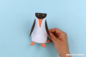 Wrap the bottom corner one way, then the other, marking the fold lines and unfold. Paper Penguin Craft The Craft Train
