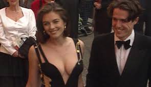 Occasionally, we use affiliate links on our site. Liz Hurley In That Dress With Hugh Grant In Leicester Square Daily Mail Online