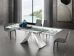 Browse made.com's full range of extending tables now! Souza Extendable Motorized Dining Table In Clear Glass Euro Living Furniture